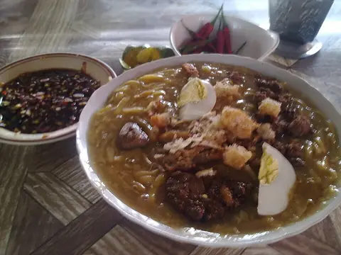 A bowl of Batangas lomi: thick egg noodles in a rich soup with toppings