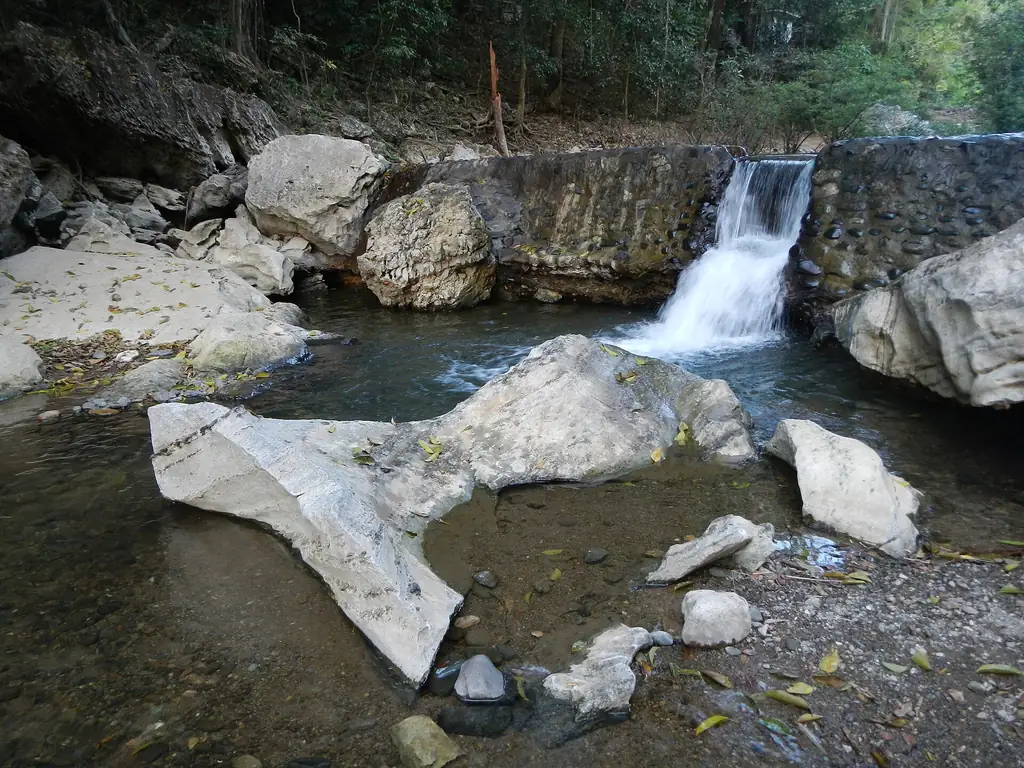 A small waterfall over limestone boulders in Biak-na-Bato National Park, San Miguel