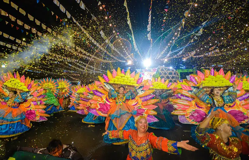Dancers in mango-coloured costumes at the Manggahan Festival, Guimaras