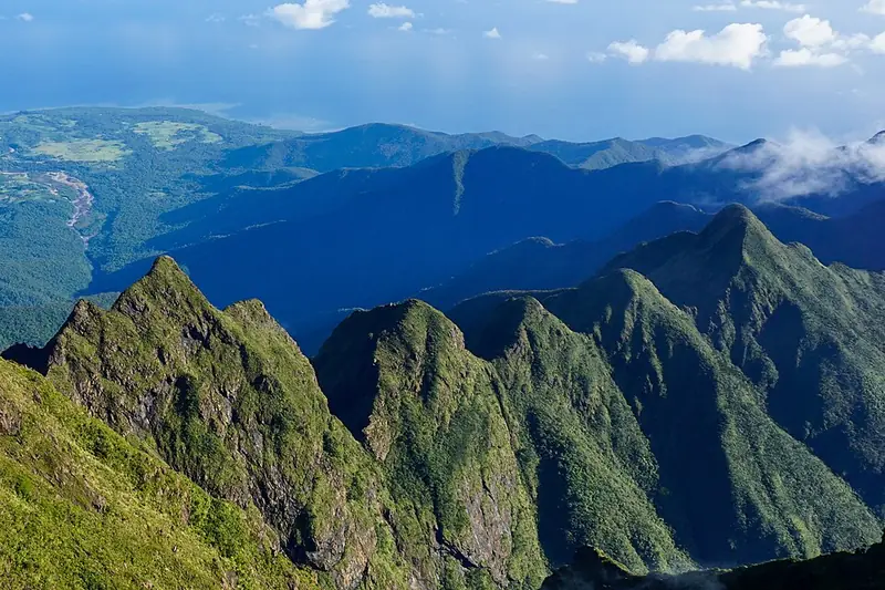 The jagged forested ridges of Mount Guiting-Guiting