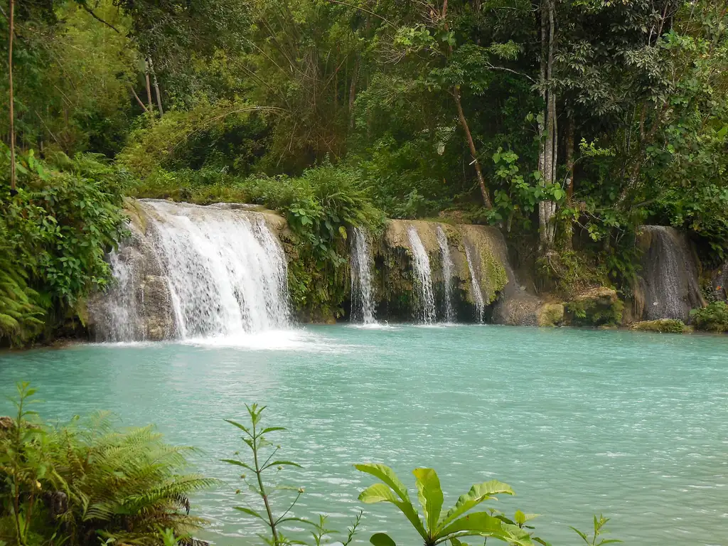 The tiered turquoise pools of Cambugahay Falls in Lazi