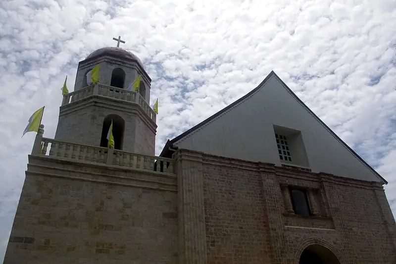 The coral-stone facade and bell tower of Lazi Church
